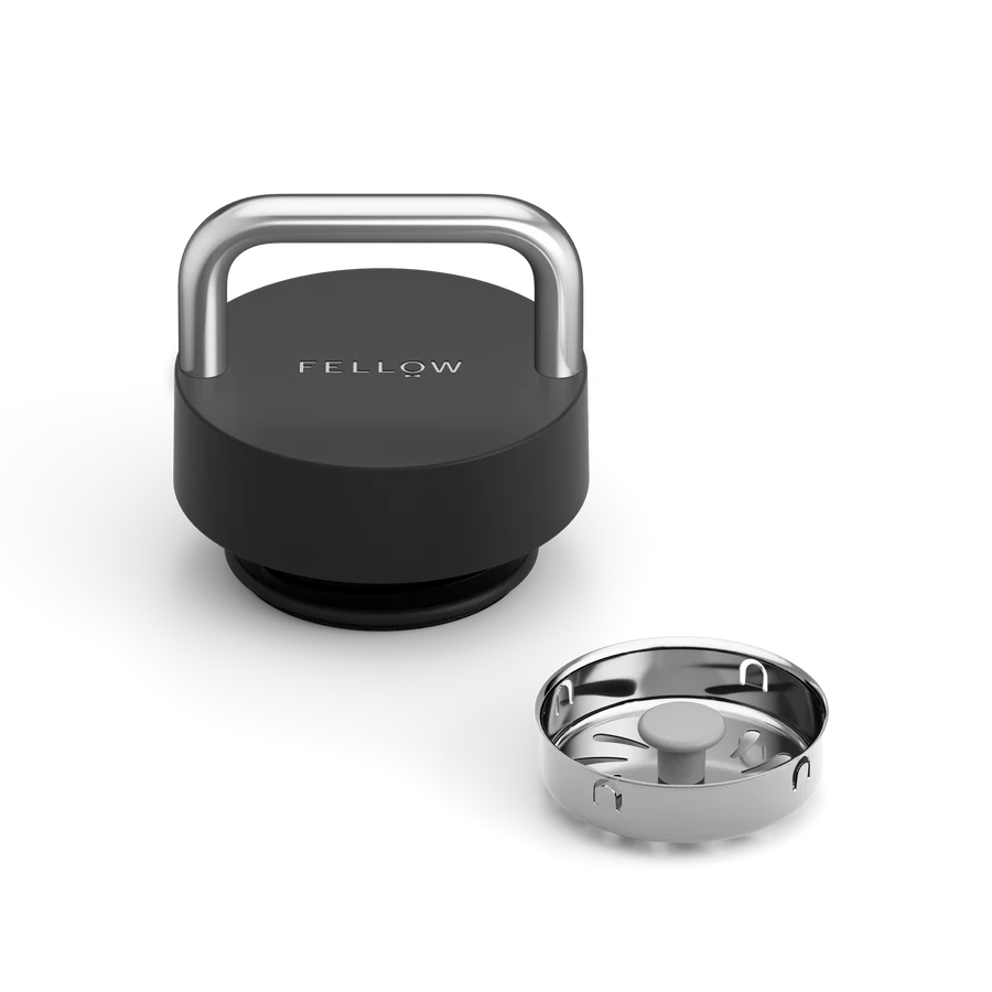Elegant insulated tumbler with ceramic coating, thin sippable lip, and premium metal handle. Holds 20 ounces and is easy to carry.