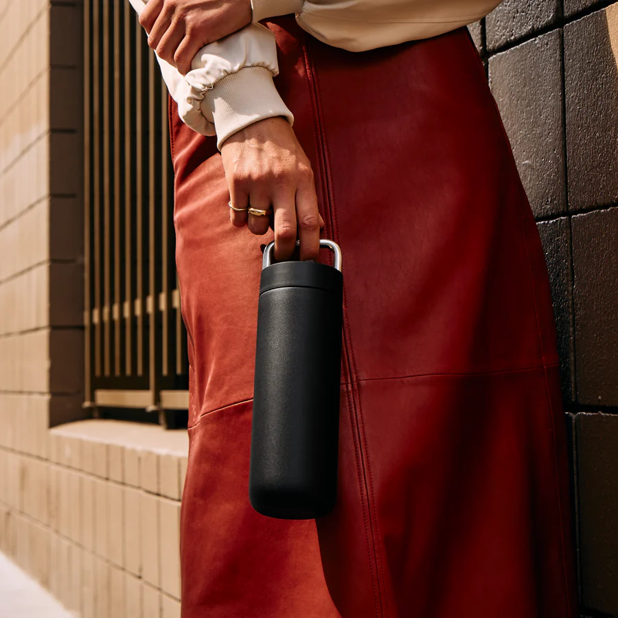 Elegant insulated tumbler with ceramic coating, thin sippable lip, and premium metal handle. Holds 20 ounces and is easy to carry.