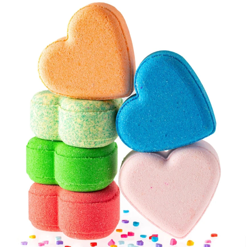 A heart-shaped bath bomb with a delightful strawberry cheesecake scent, perfect for a relaxing and indulgent self-care experience or a sweet gift.