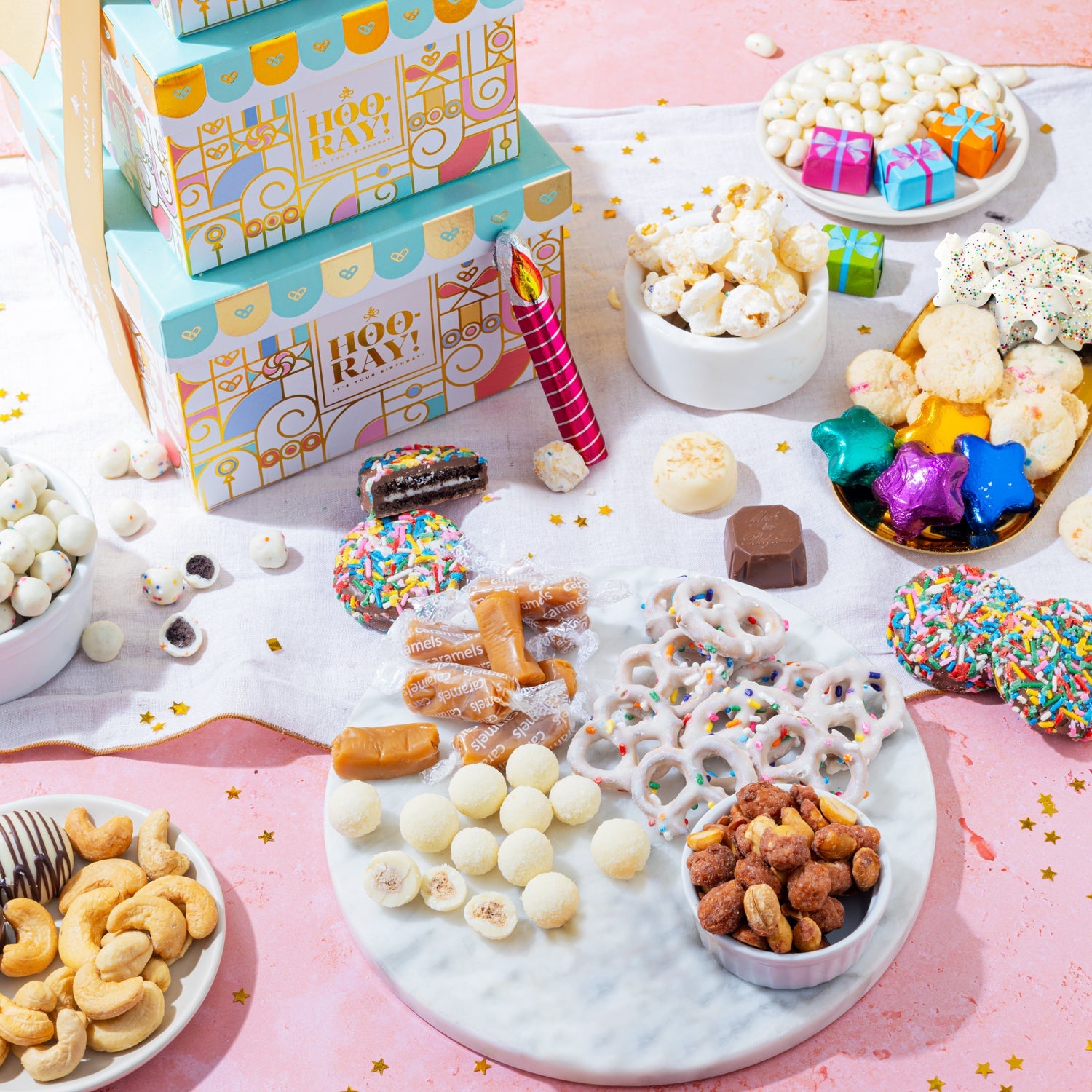 Make every birthday unforgettable. This three-tier birthday gift tower is packed with chocolates, cookies, nuts, and festive treats—beautifully wrapped and ready to wow.