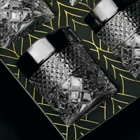 Elegant set of Admiral whiskey glasses set against a stylish geometric background, perfect for cocktails and spirits.
