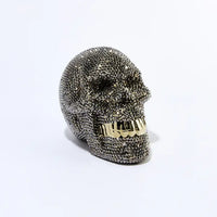 Rhinestone skull piggy bank adorned with sparkling rhinestones, striking decor and functional accessory. Perfect for storing coins and small bills. 