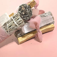 A Sage & Crystal Set featuring a white sage smudge stick and a healing crystal, perfect for cleansing, grounding, and bringing positive energy to any space.