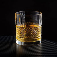 Crystal whiskey glass filled with bourbon, showcasing elegance and clarity, perfect for barware or gift sets.