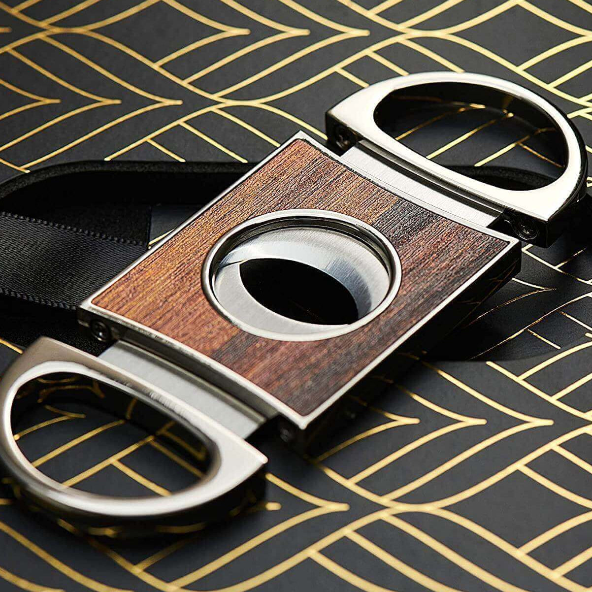 Elegant cigar cutter featuring wooden design and stainless steel accents, perfect accessory for cigar aficionados.