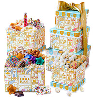 A three-tiered gift tower with an assortment of chocolate covered and other sweet snacks, wrapped in birthday-themed packaging with decorative gold ribbon.