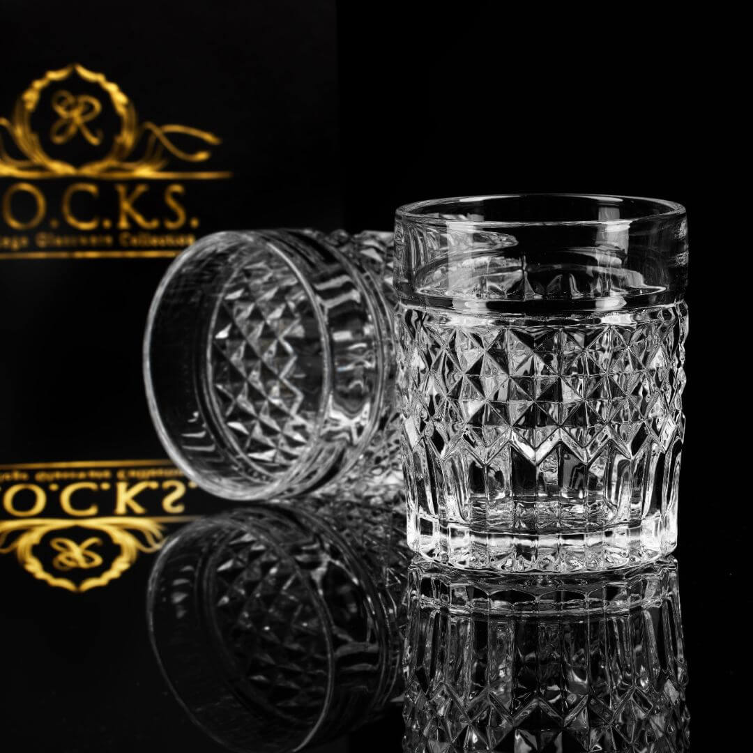 Set of two Prestige whiskey glasses with a diamond cut design, perfect for elegant cocktail experiences.