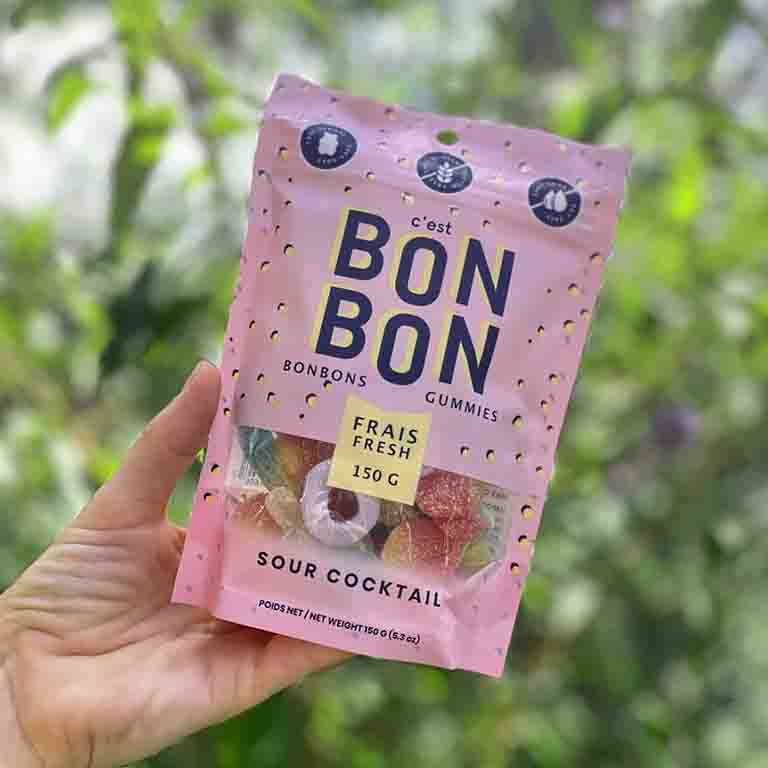 A bag of tangy and delicious sour bon bon gummies, perfect for satisfying your sweet tooth or adding a playful treat to any gift.