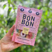 A bag of tangy and delicious sour bon bon gummies, perfect for satisfying your sweet tooth or adding a playful treat to any gift.