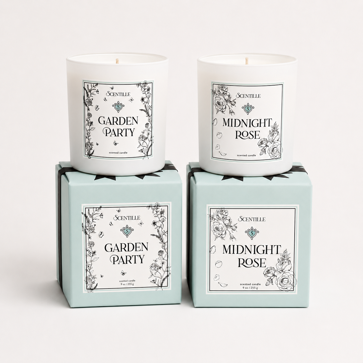 Two candles named 'Midnight Rose' and 'Garden Party' in their packaging on a white background.
