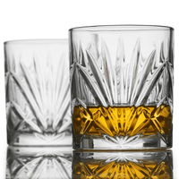 Crystal whiskey glasses highlighting rich bourbon color, perfect for cocktails and gifts for men.